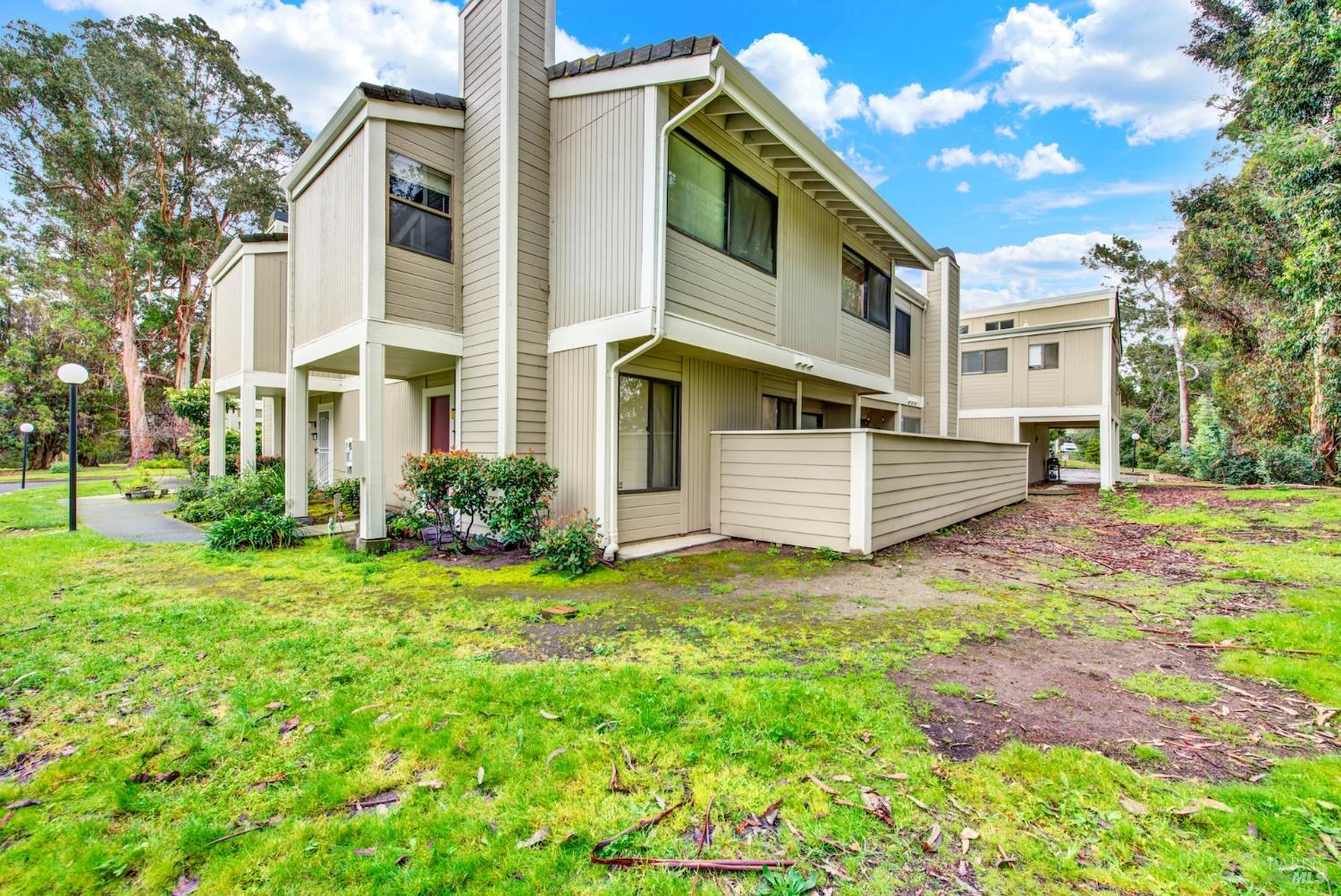 216 Apollo, Unit 7 Hercules, CA 94547 - Photo 2 of 29 a view of a white house with a yard