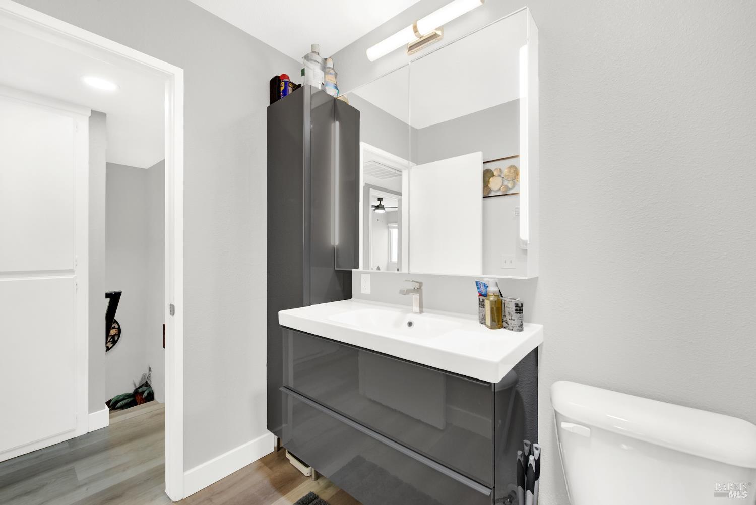 216 Apollo, Unit 7 Hercules, CA 94547 - Photo 22 of 29 a bathroom with a sink toilet and mirror