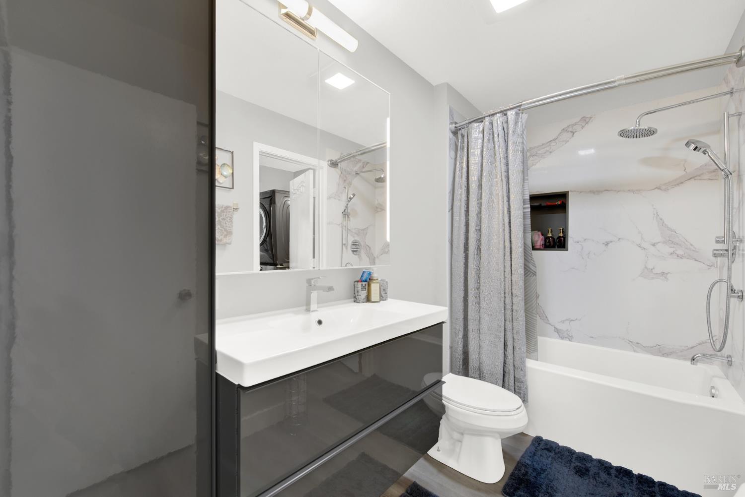 216 Apollo, Unit 7 Hercules, CA 94547 - Photo 23 of 29 a bathroom with a sink and a mirror