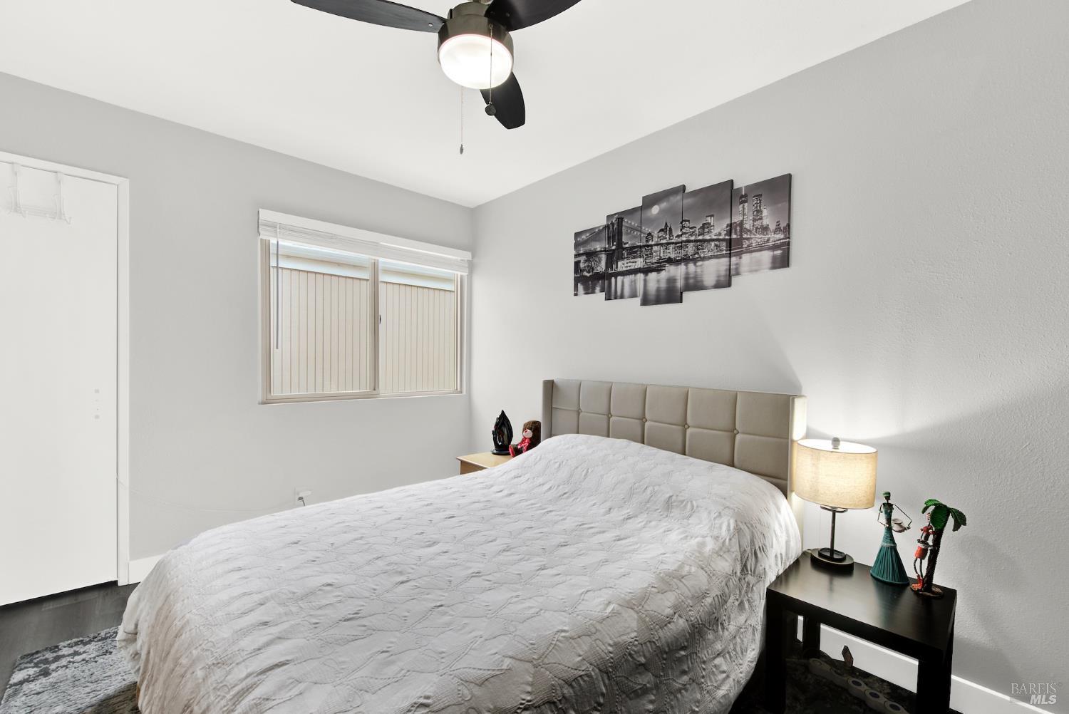 216 Apollo, Unit 7 Hercules, CA 94547 - Photo 24 of 29 a bedroom with a bed and wooden floor