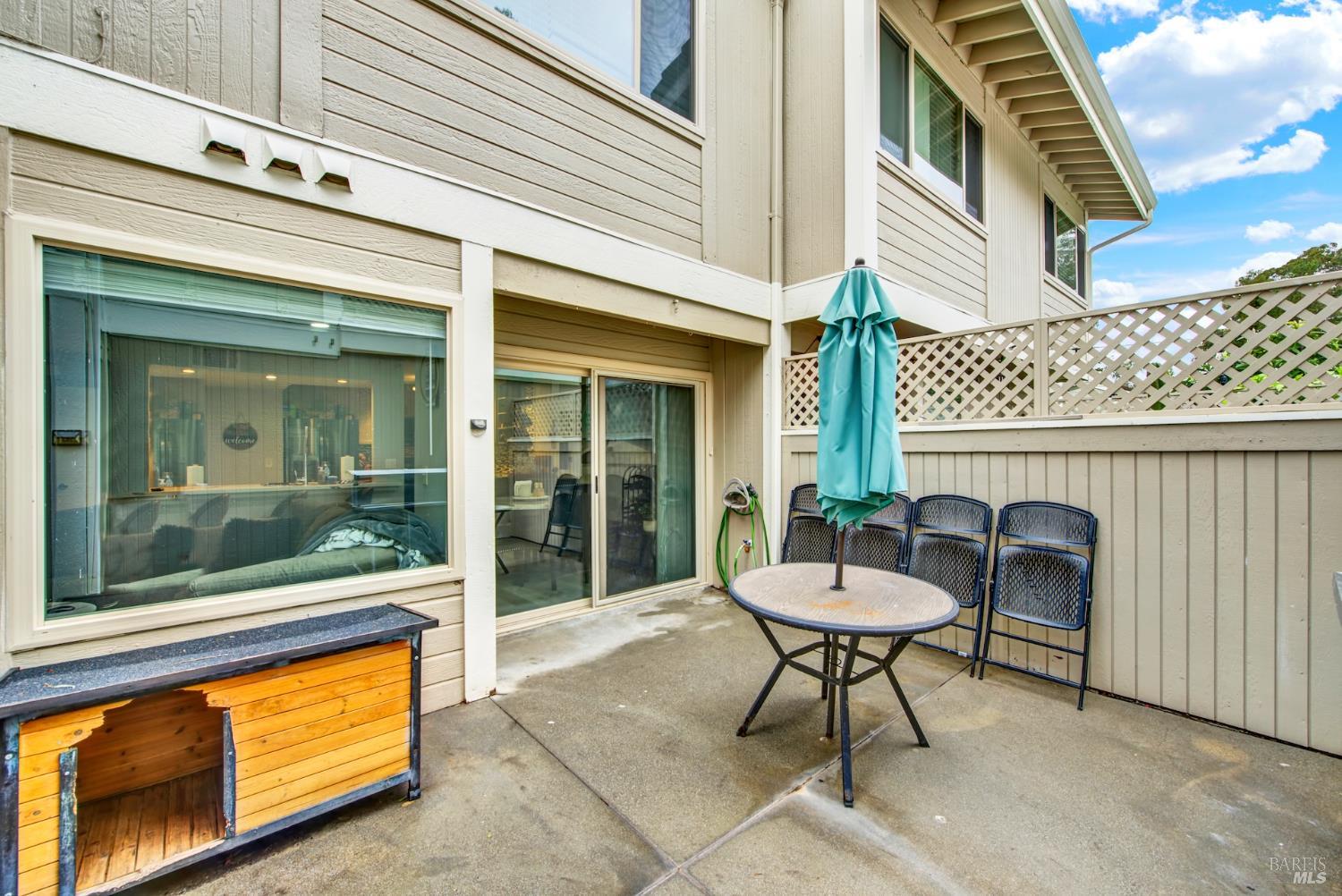 216 Apollo, Unit 7 Hercules, CA 94547 - Photo 26 of 29 a view of a patio with a chairs and table in a patio