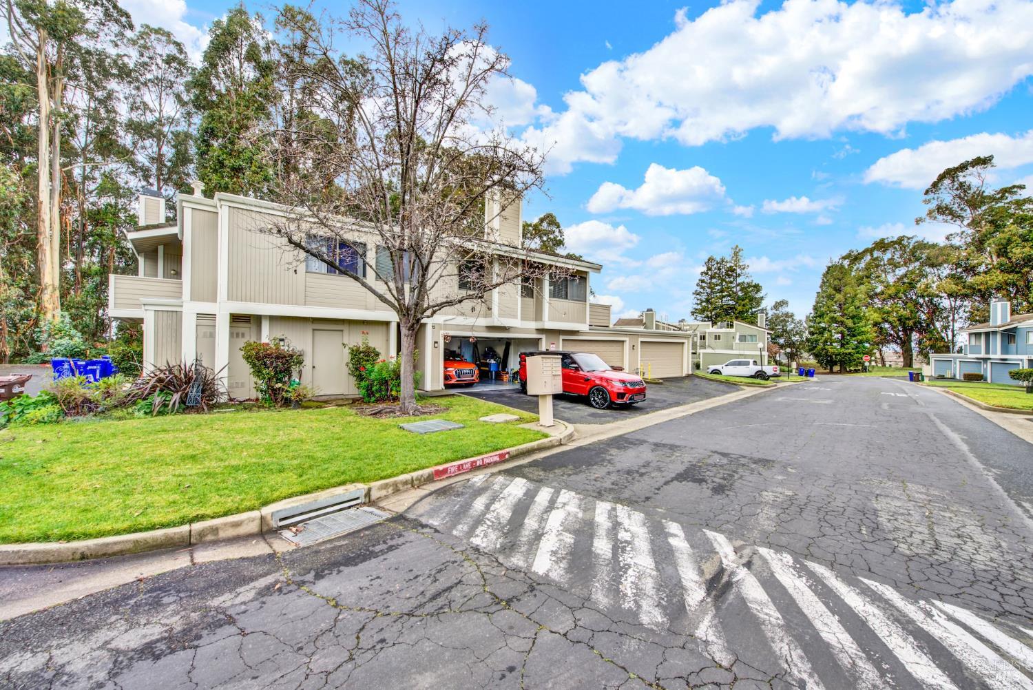 216 Apollo, Unit 7 Hercules, CA 94547 - Photo 5 of 29 a view of a big house with a big yard and large trees