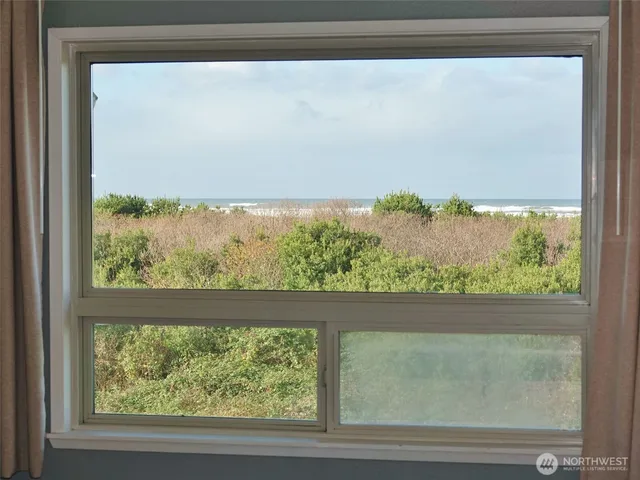 a bathroom with a sink a toilet and a shower