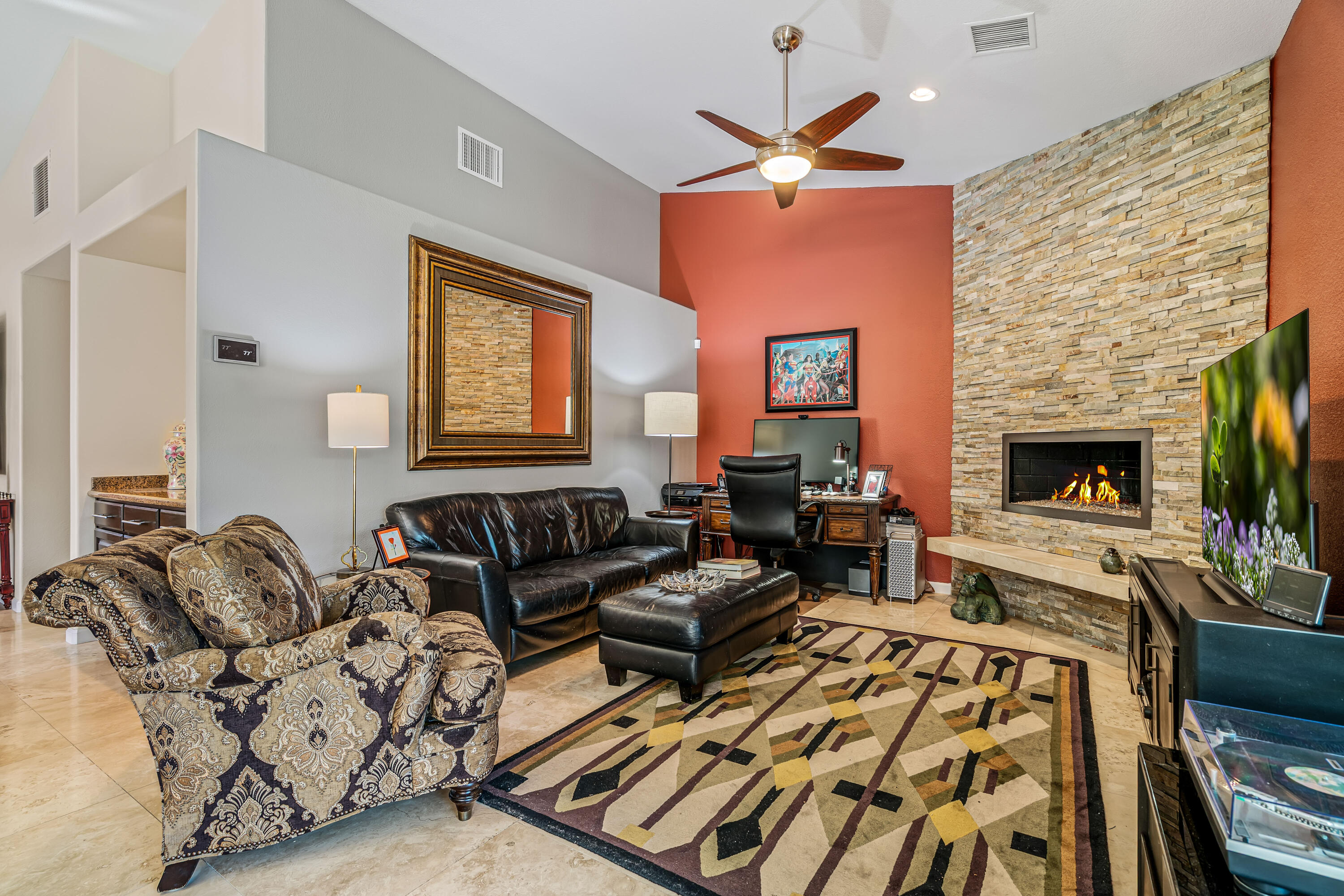 36690 Palm Court Rancho Mirage, CA 92270 - Photo 14 of 54 a living room with furniture fireplace and a flat screen tv