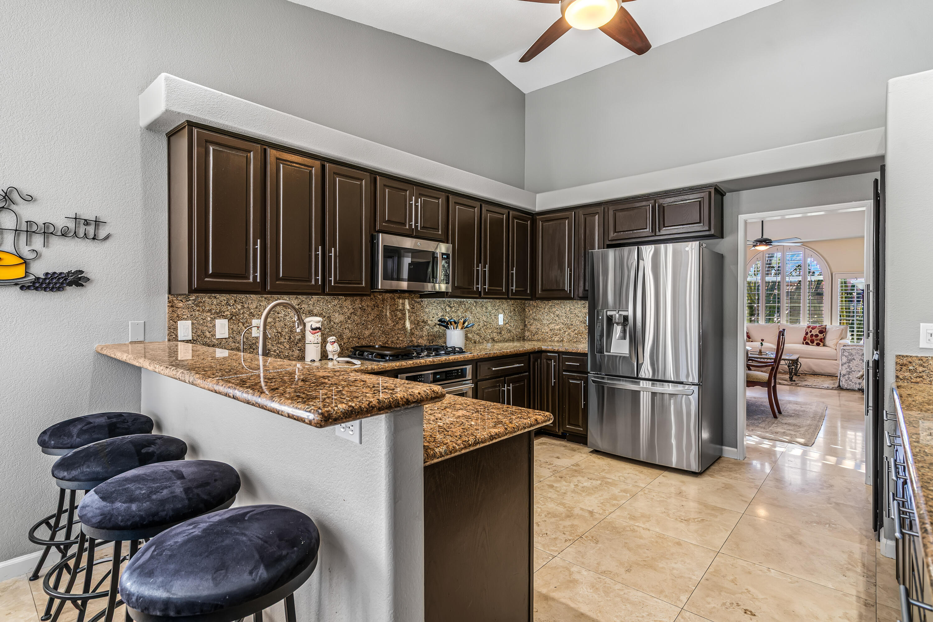 36690 Palm Court Rancho Mirage, CA 92270 - Photo 18 of 54 a kitchen with stainless steel appliances granite countertop a refrigerator stove and sink