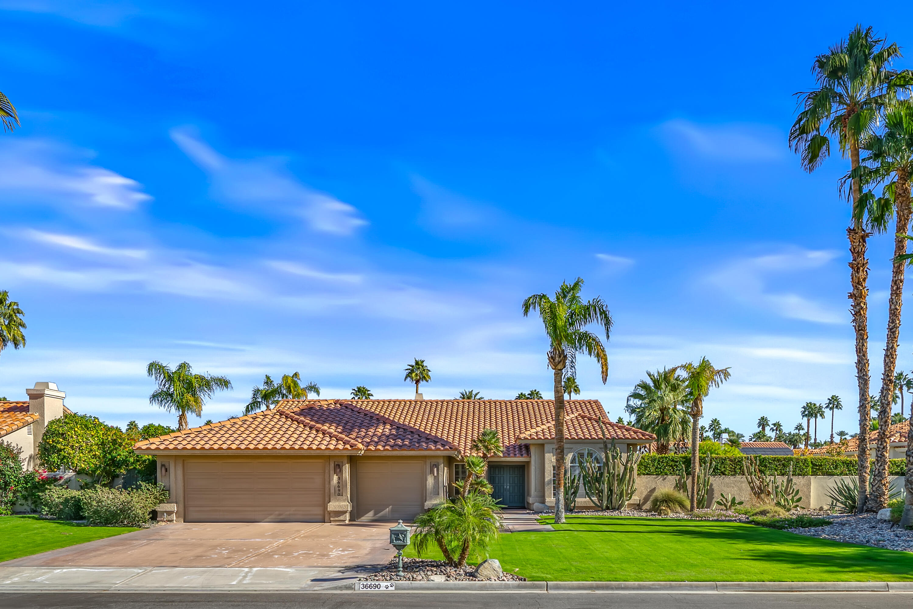 36690 Palm Court Rancho Mirage, CA 92270 - Photo 2 of 54 a view of a house with a yard and potted plants