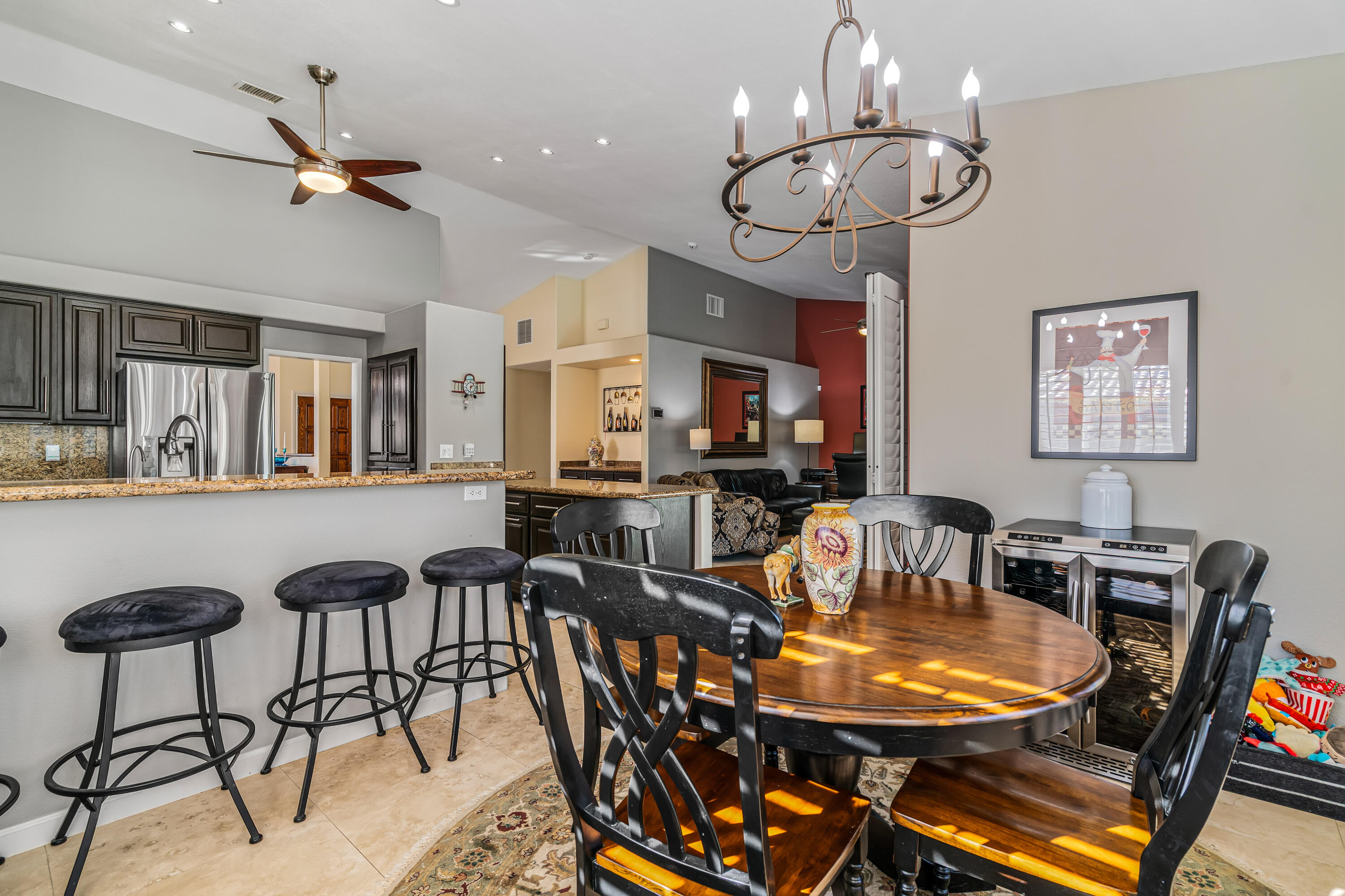 36690 Palm Court Rancho Mirage, CA 92270 - Photo 22 of 54 a view of a dining room with furniture and chandelier