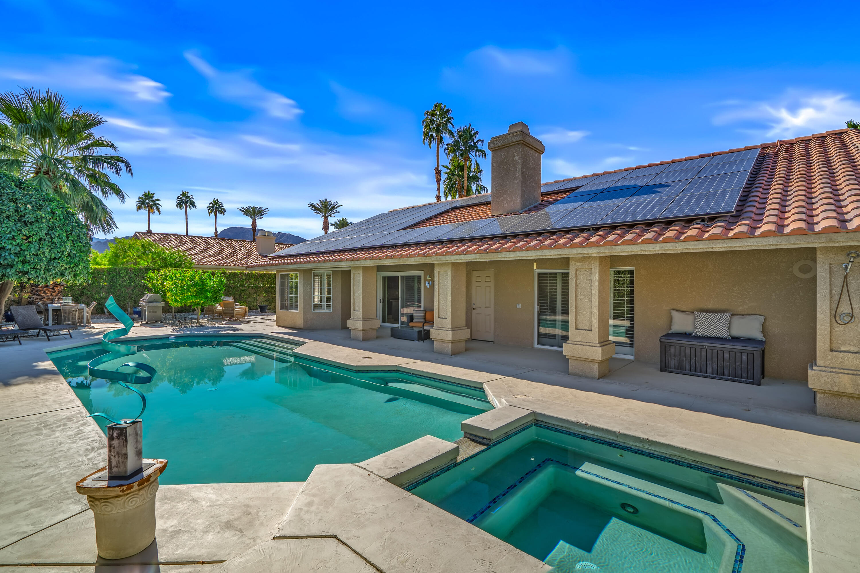 36690 Palm Court Rancho Mirage, CA 92270 - Photo 40 of 54 a front view of a house with garden
