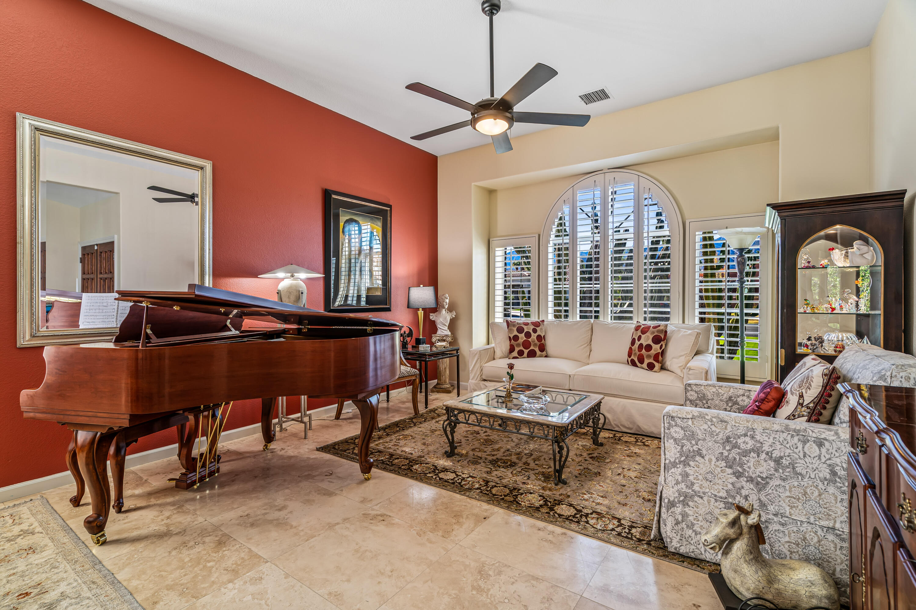 36690 Palm Court Rancho Mirage, CA 92270 - Photo 9 of 54 a living room with furniture ceiling fan and a large window