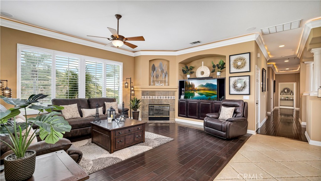 23894 Trail Duster Court Perris, CA 92570 - Photo 15 of 75 a living room with furniture large window and fireplace