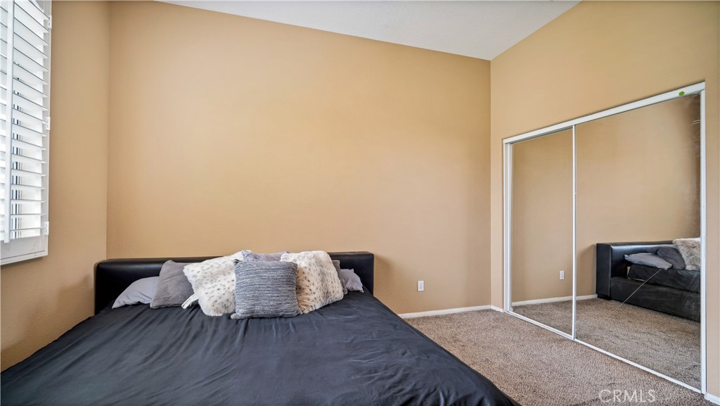 23894 Trail Duster Court Perris, CA 92570 - Photo 30 of 75 a living room with furniture and a potted plant