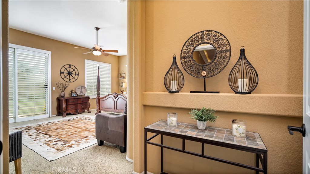 23894 Trail Duster Court Perris, CA 92570 - Photo 36 of 75 a bathroom with a sink a mirror and a shower
