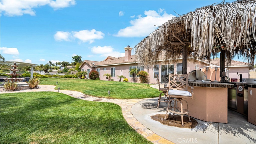 23894 Trail Duster Court Perris, CA 92570 - Photo 52 of 75 a view of a house with backyard porch and sitting area