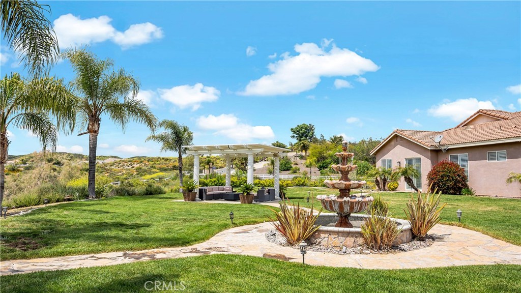 23894 Trail Duster Court Perris, CA 92570 - Photo 53 of 75 a view of a very nice looking yard with a fountain