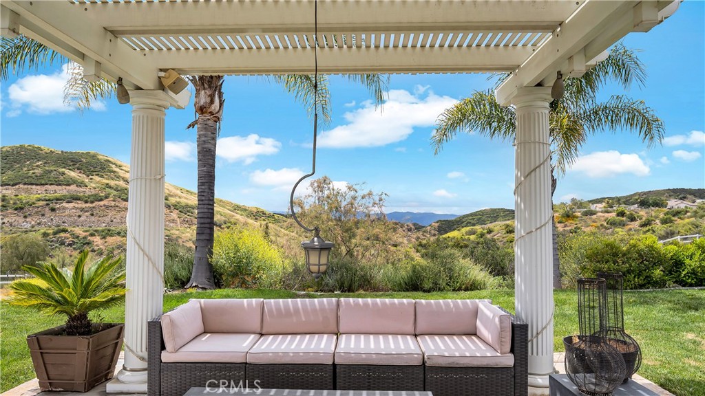 23894 Trail Duster Court Perris, CA 92570 - Photo 60 of 75 a view of a porch with furniture and a yard