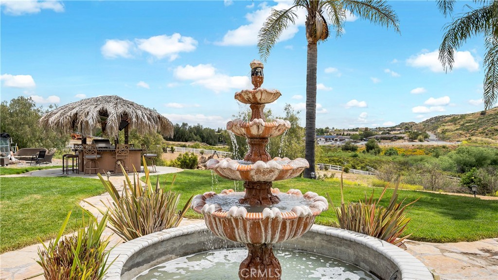 23894 Trail Duster Court Perris, CA 92570 - Photo 61 of 75 a view of a fountain in the backyard of a house