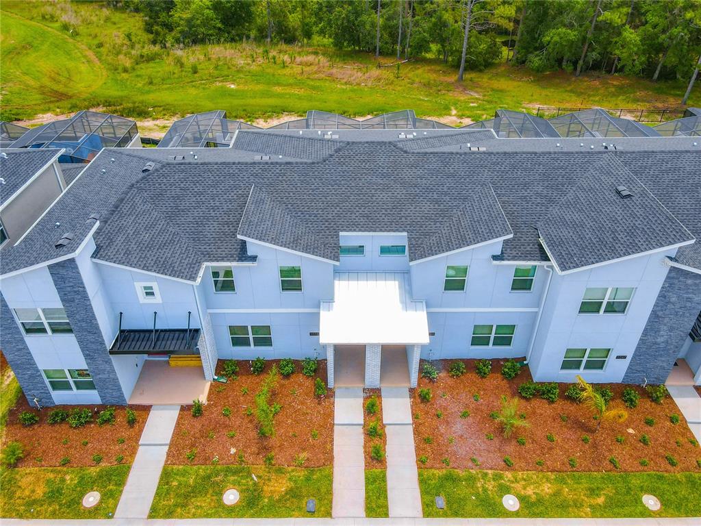 2573 Reading Trail Kissimmee, FL 34746 - Photo 2 of 54 an aerial view of residential houses with swimming pool