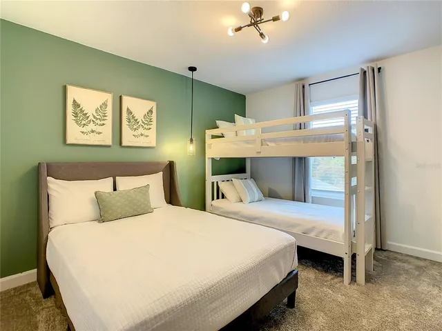 a bedroom with a bed and a table