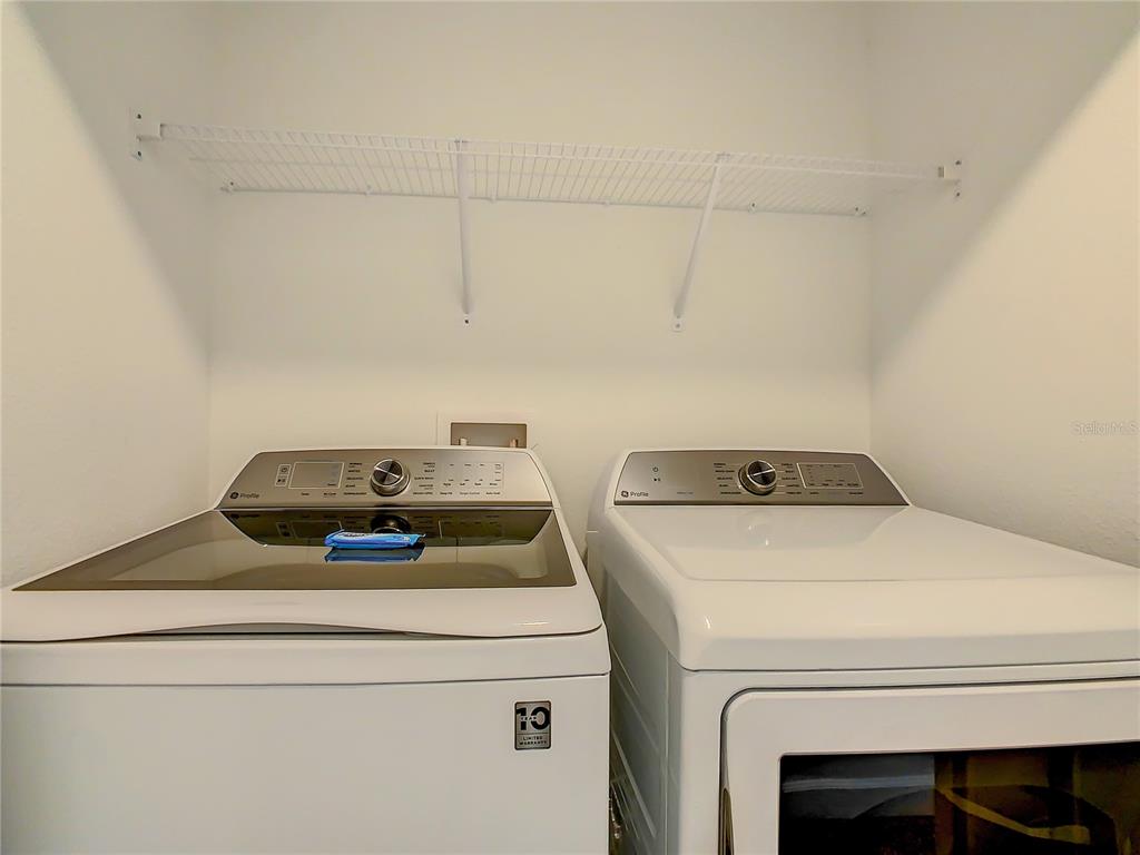 2573 Reading Trail Kissimmee, FL 34746 - Photo 41 of 54 a utility room with dryer and washer