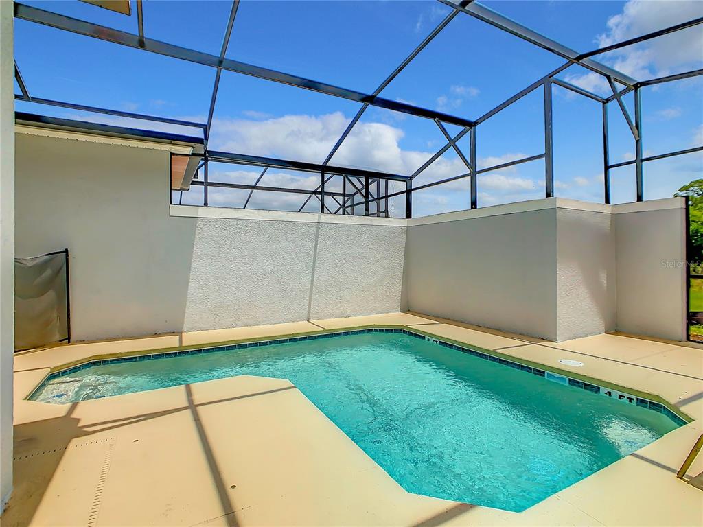 2573 Reading Trail Kissimmee, FL 34746 - Photo 44 of 54 a view of a backyard of the house