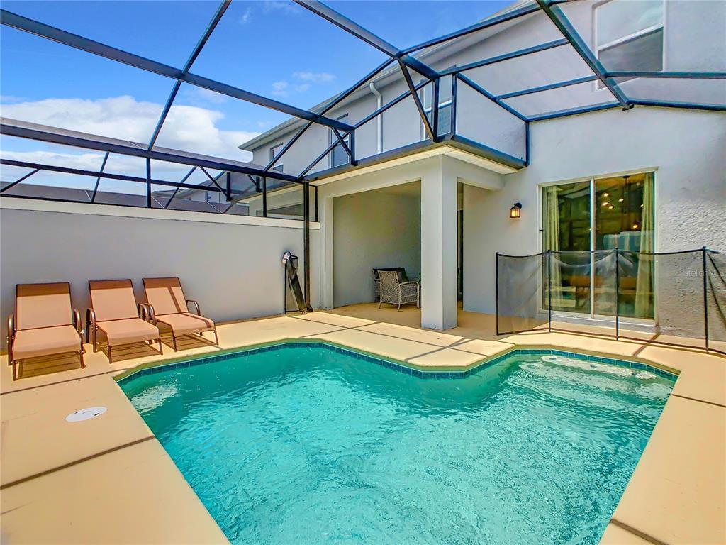 2573 Reading Trail Kissimmee, FL 34746 - Photo 46 of 54 a backyard of a house with seating space