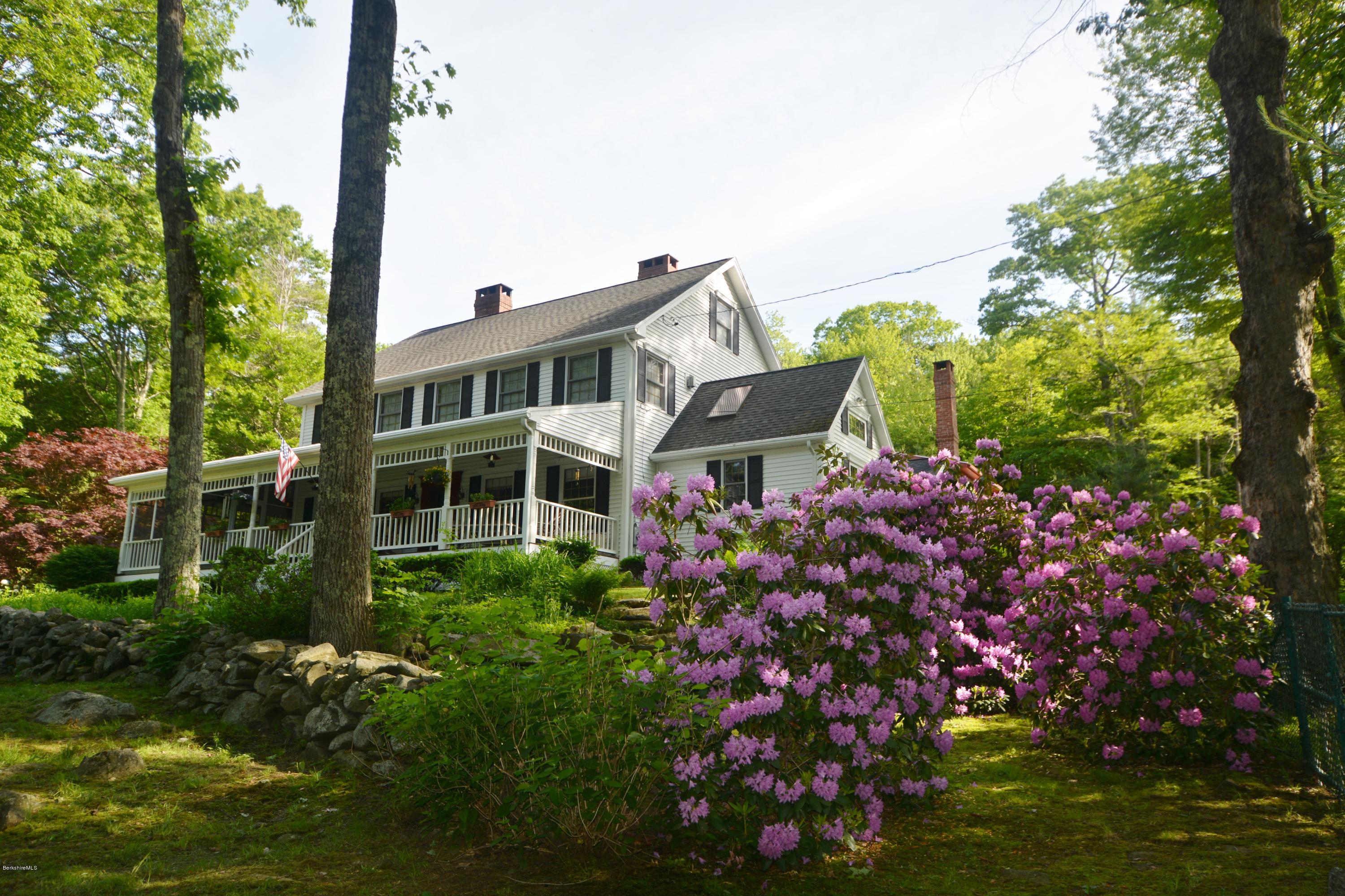 99 Kibbe Road Otis, MA 01029 - Photo 1 of 58 a house with lots of flowers