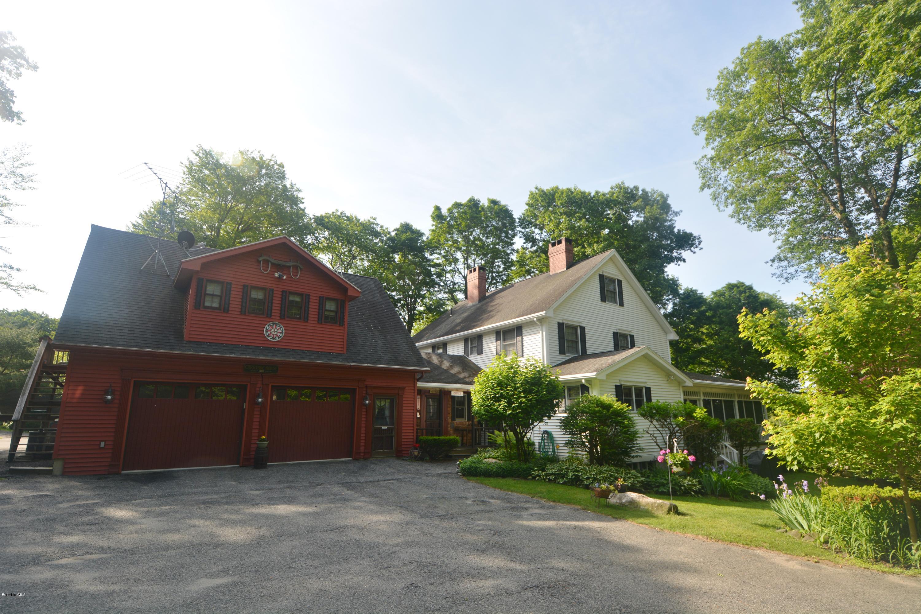 99 Kibbe Road Otis, MA 01029 - Photo 2 of 58 front view of a house with a garden