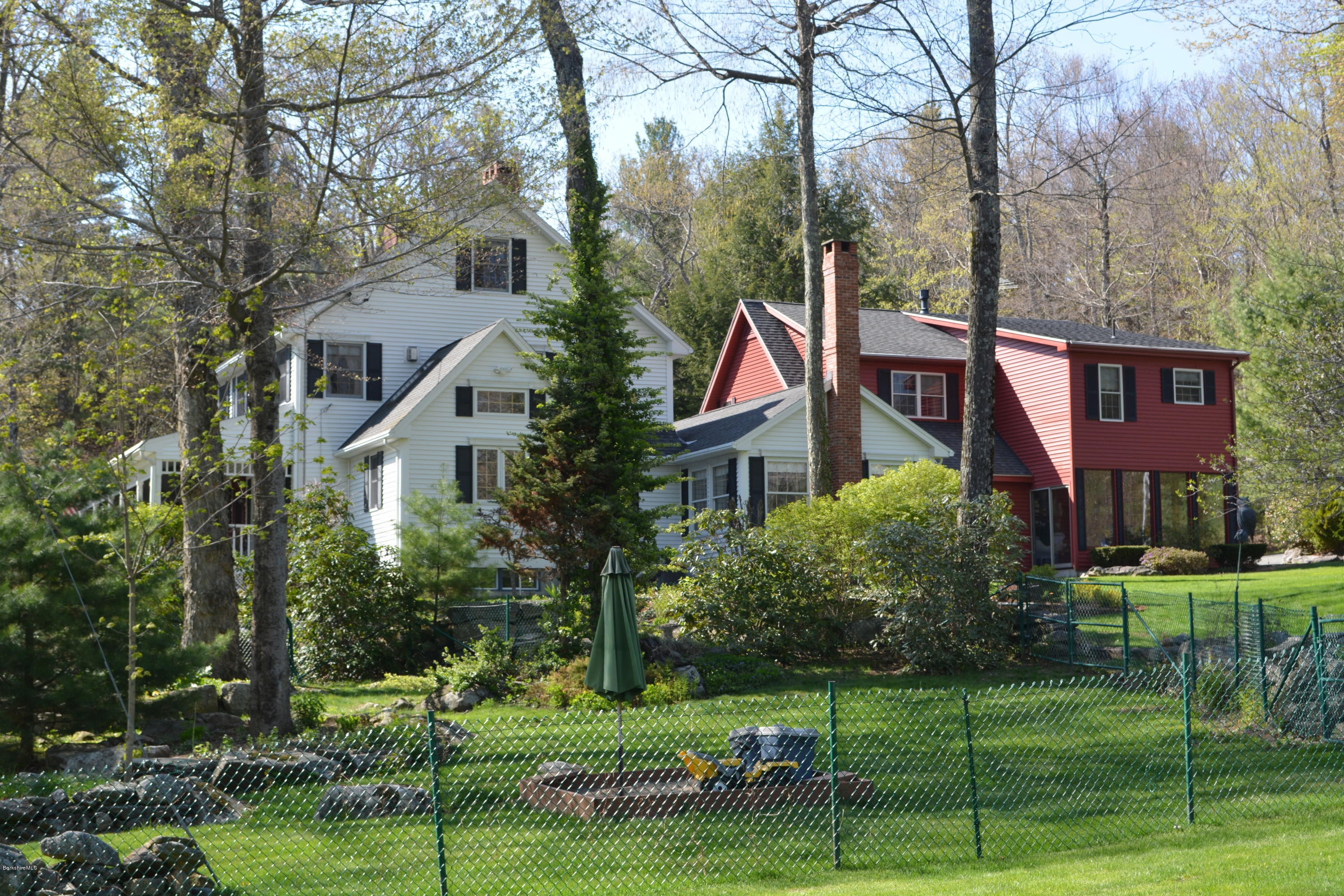 99 Kibbe Road Otis, MA 01029 - Photo 11 of 58 a view of a house with a big yard plants and large trees