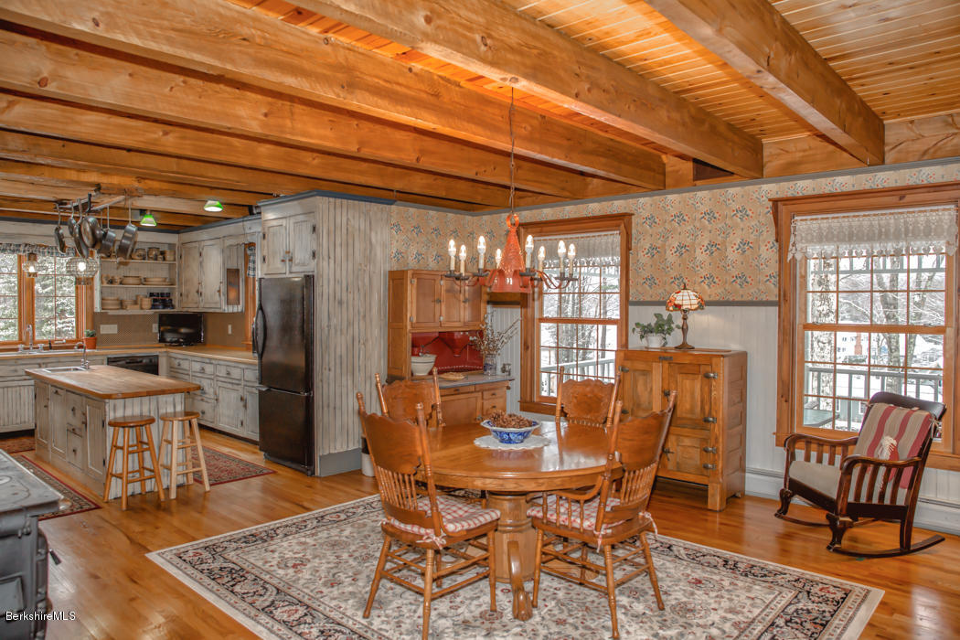 99 Kibbe Road Otis, MA 01029 - Photo 20 of 58 a view of a dining room with furniture