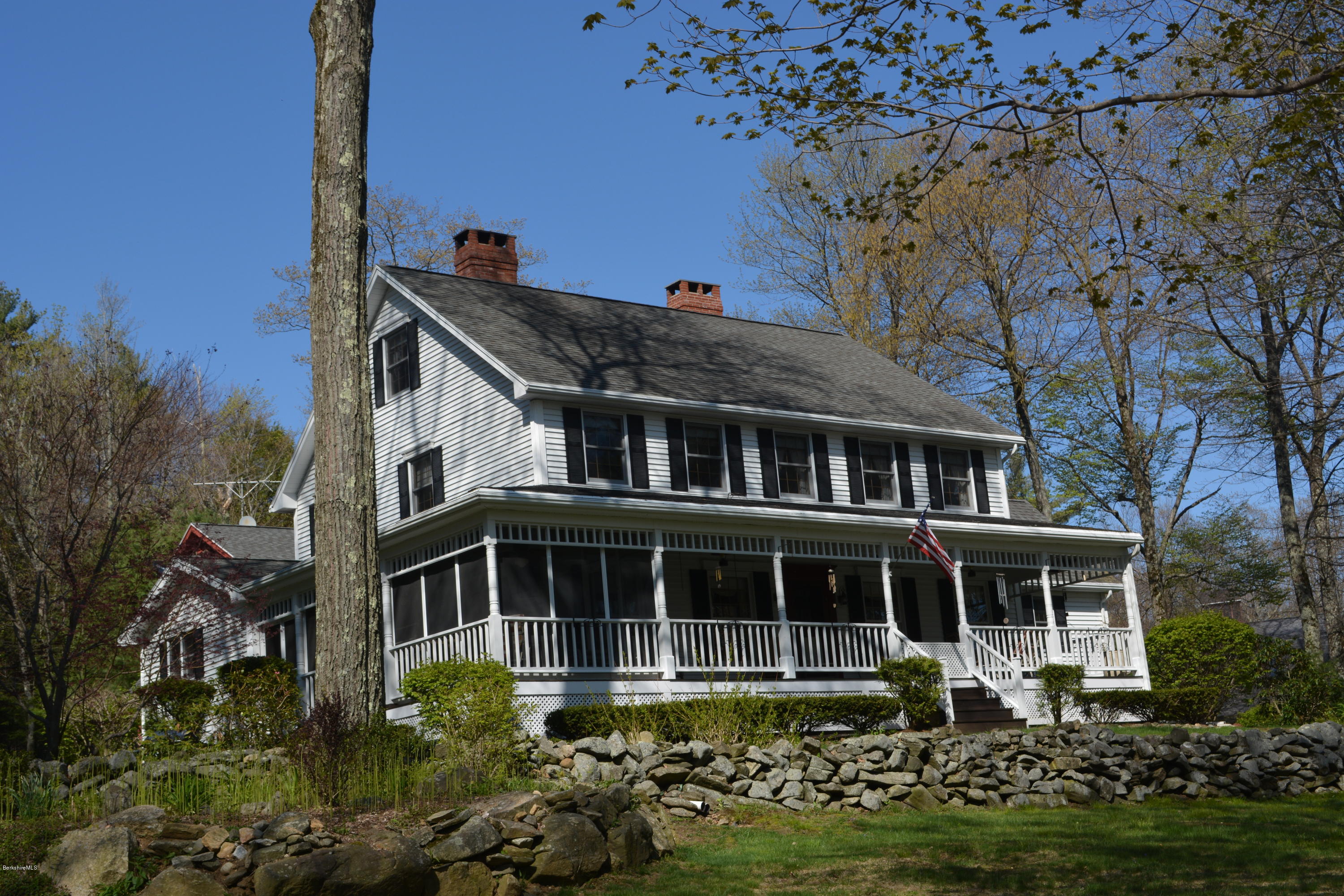 99 Kibbe Road Otis, MA 01029 - Photo 3 of 58 a front view of a house with a garden and plants