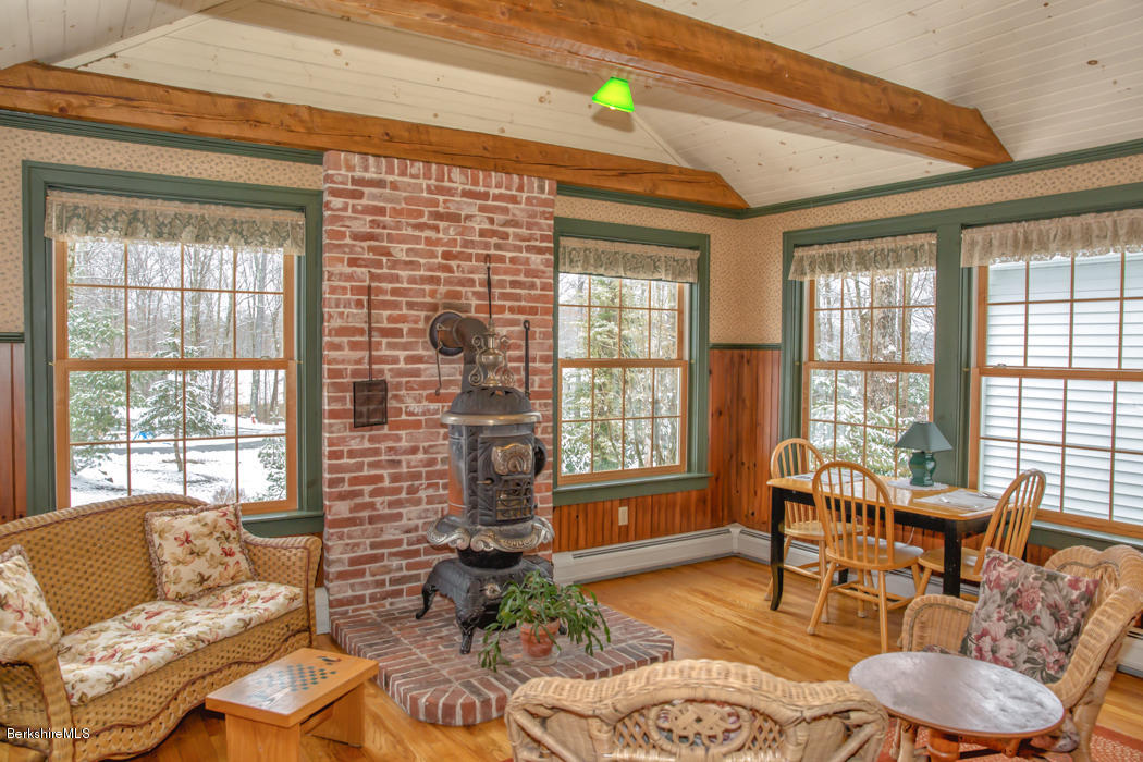 99 Kibbe Road Otis, MA 01029 - Photo 27 of 58 a living room with furniture and a window