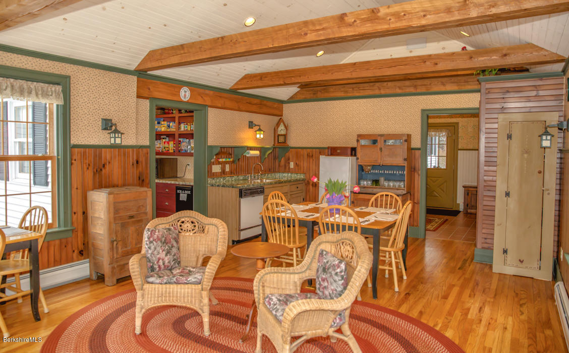 99 Kibbe Road Otis, MA 01029 - Photo 28 of 58 a view of a dining room with furniture window and wooden floor