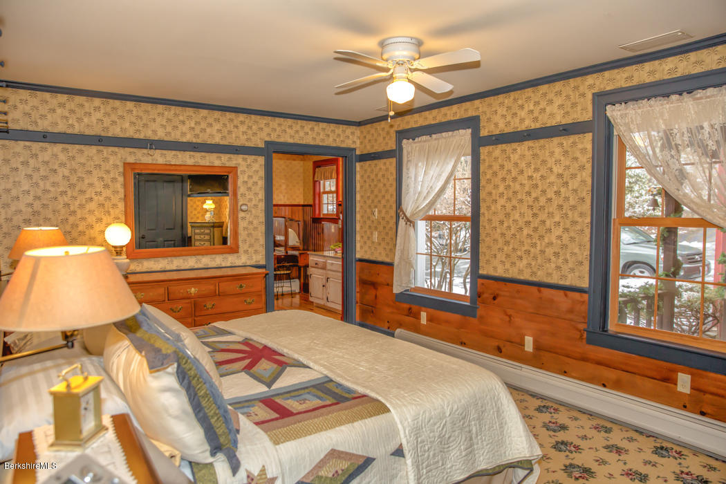 99 Kibbe Road Otis, MA 01029 - Photo 32 of 58 a bedroom with a bed and a large window with outer view