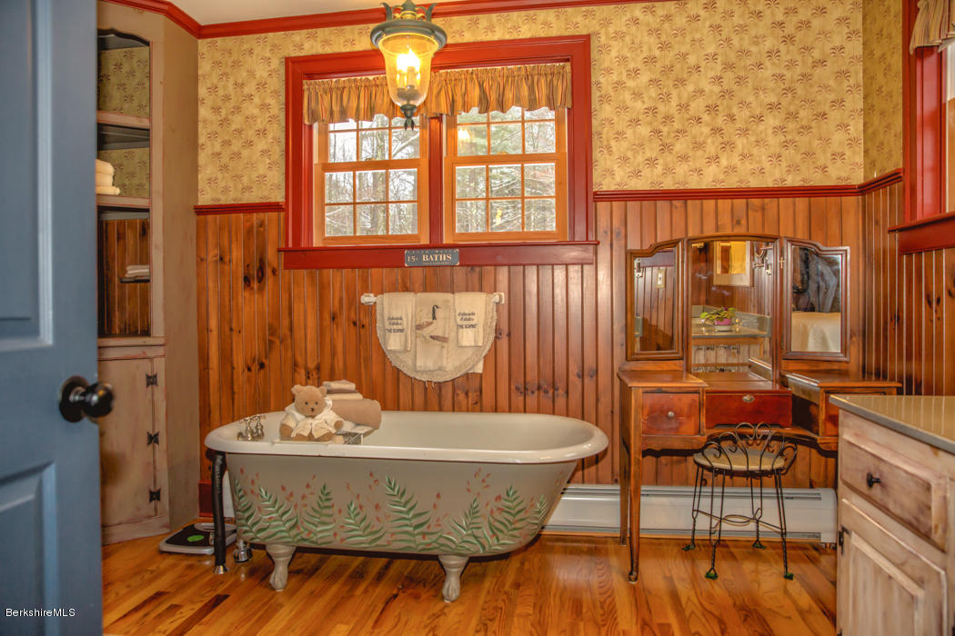 99 Kibbe Road Otis, MA 01029 - Photo 33 of 58 a dining room with furniture and wooden floor