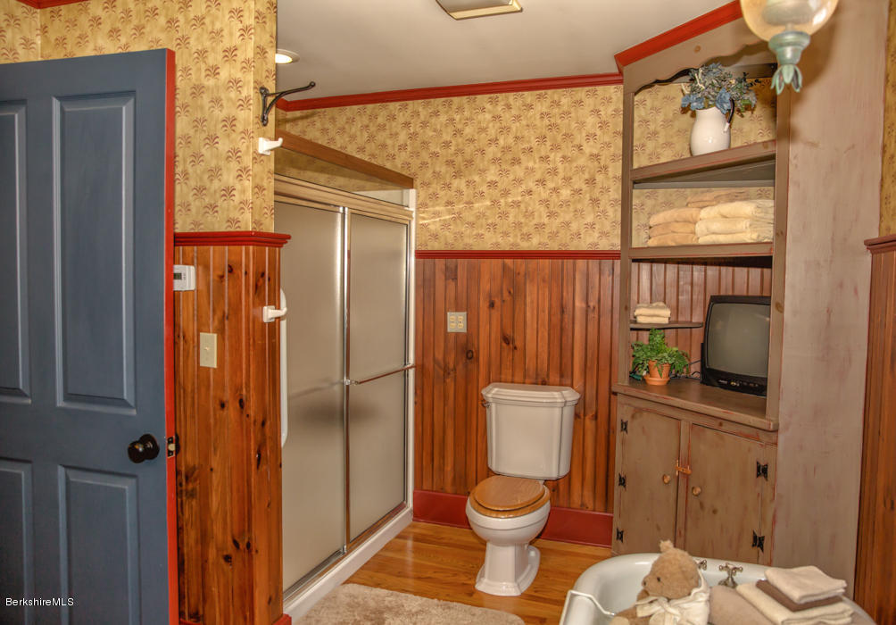99 Kibbe Road Otis, MA 01029 - Photo 35 of 58 a bathroom with a toilet a sink and shower