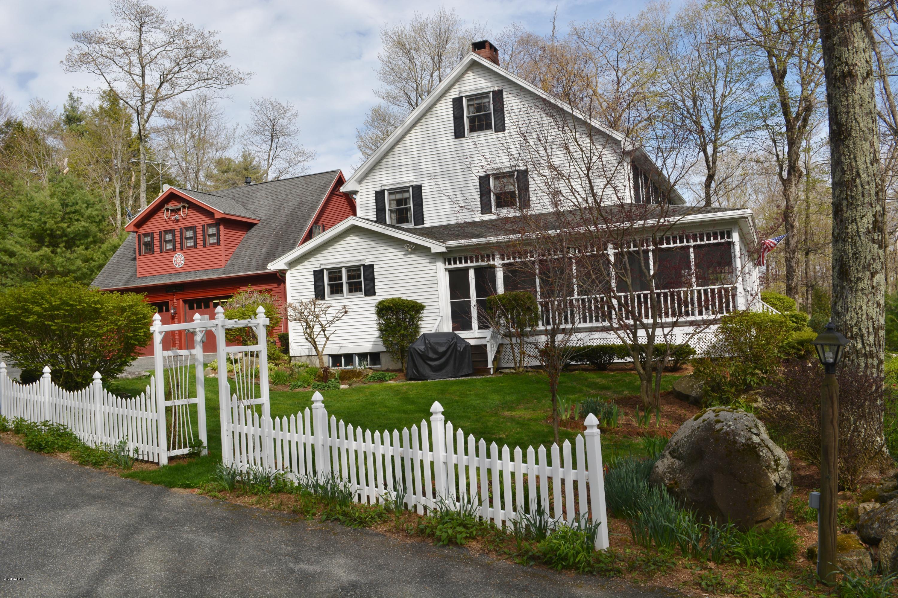 99 Kibbe Road Otis, MA 01029 - Photo 5 of 58 a front view of a house with a yard
