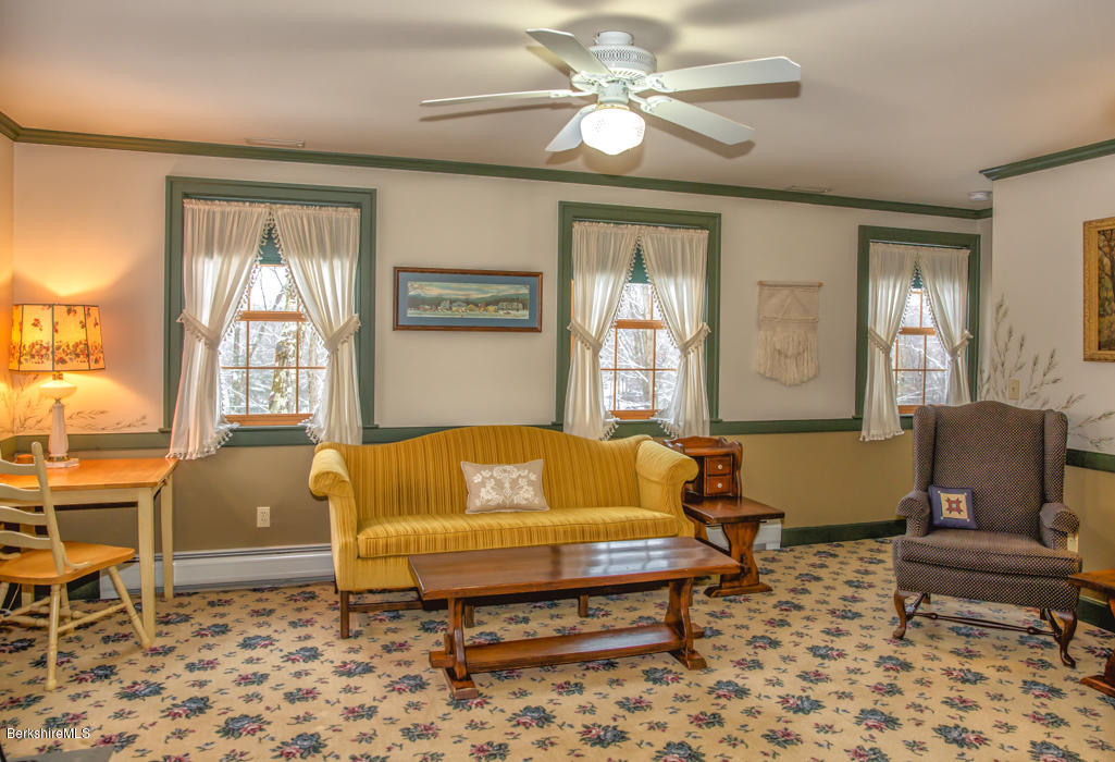 99 Kibbe Road Otis, MA 01029 - Photo 47 of 58 a living room with a couch and a table