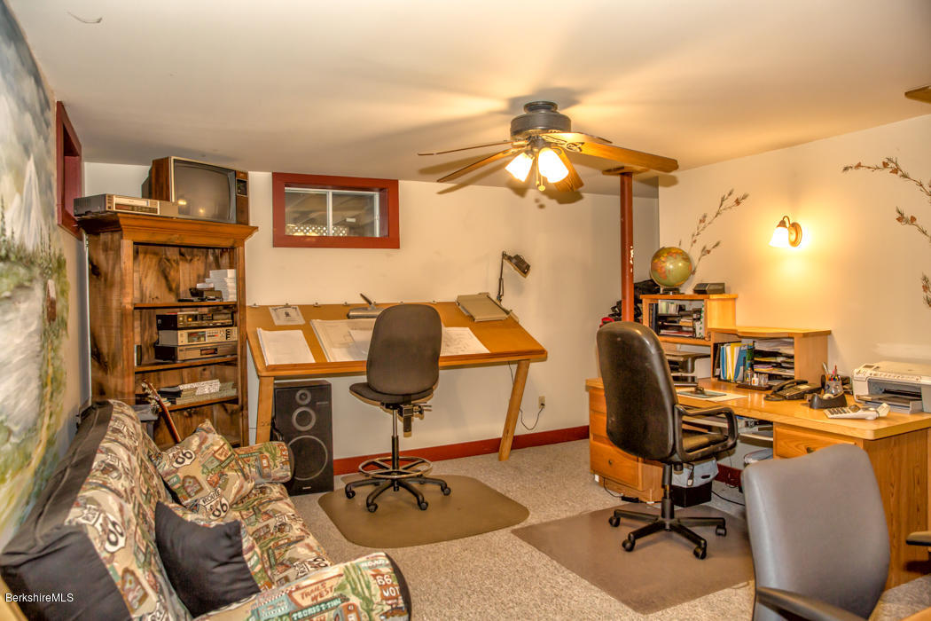 99 Kibbe Road Otis, MA 01029 - Photo 50 of 58 a view of a workspace with furniture and a window