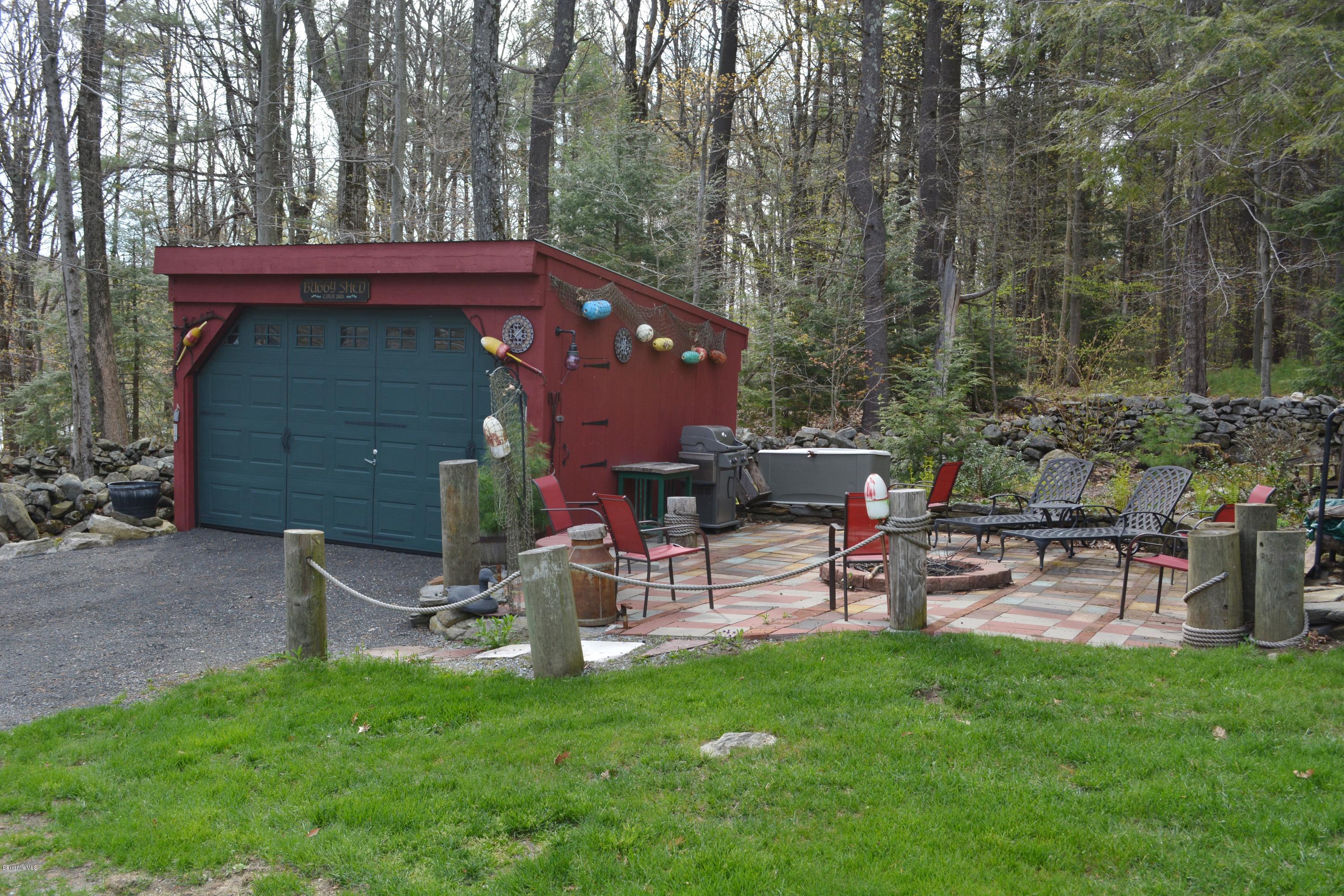 99 Kibbe Road Otis, MA 01029 - Photo 6 of 58 a view of a chairs and table in the back yard