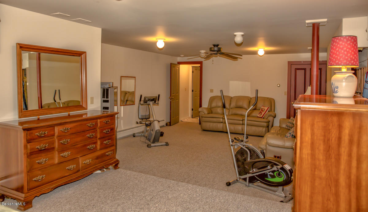 99 Kibbe Road Otis, MA 01029 - Photo 52 of 58 a view of a livingroom with furniture and a view of bathroom