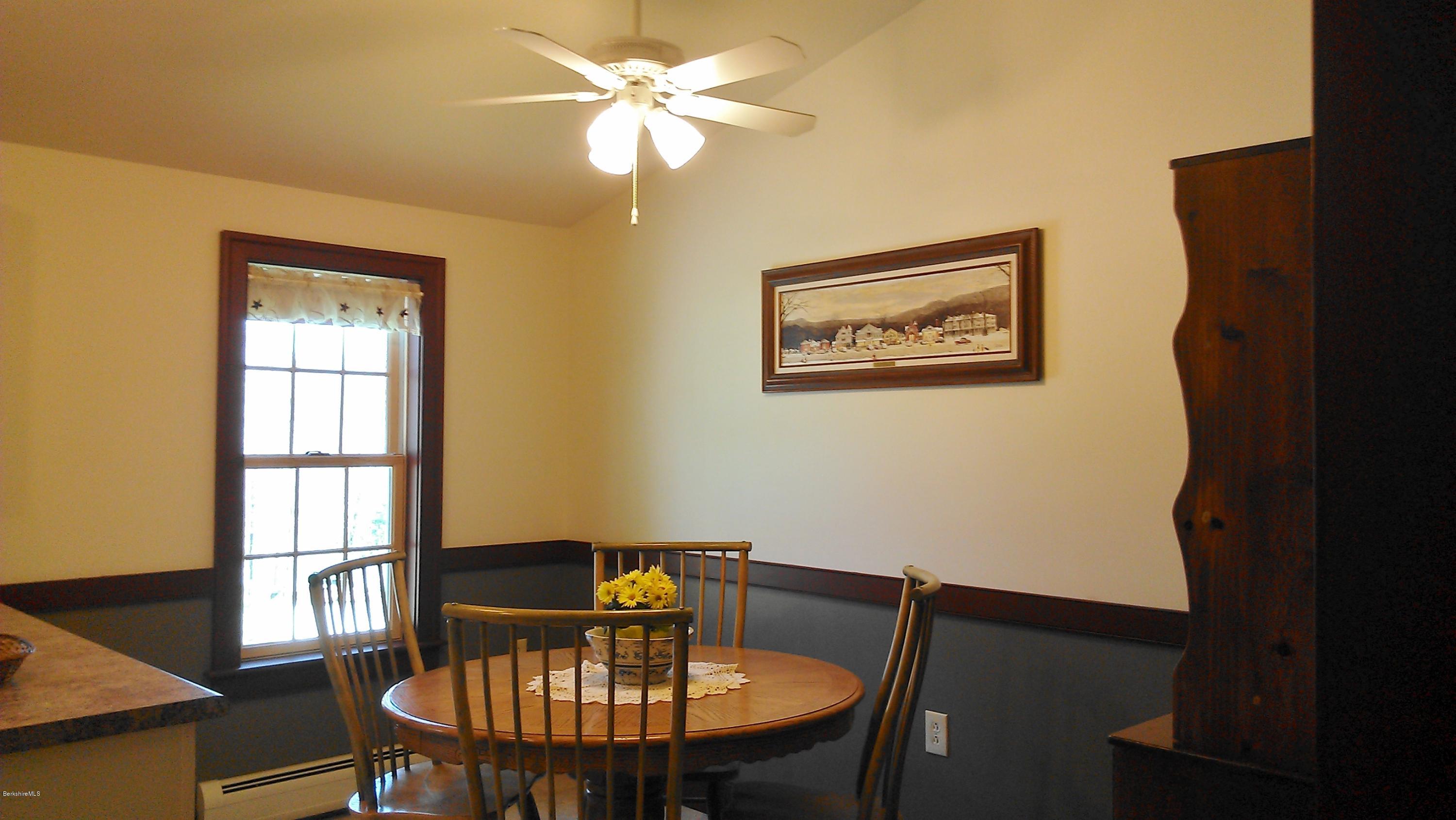 99 Kibbe Road Otis, MA 01029 - Photo 57 of 58 a view of a dining room with furniture window and wooden floor