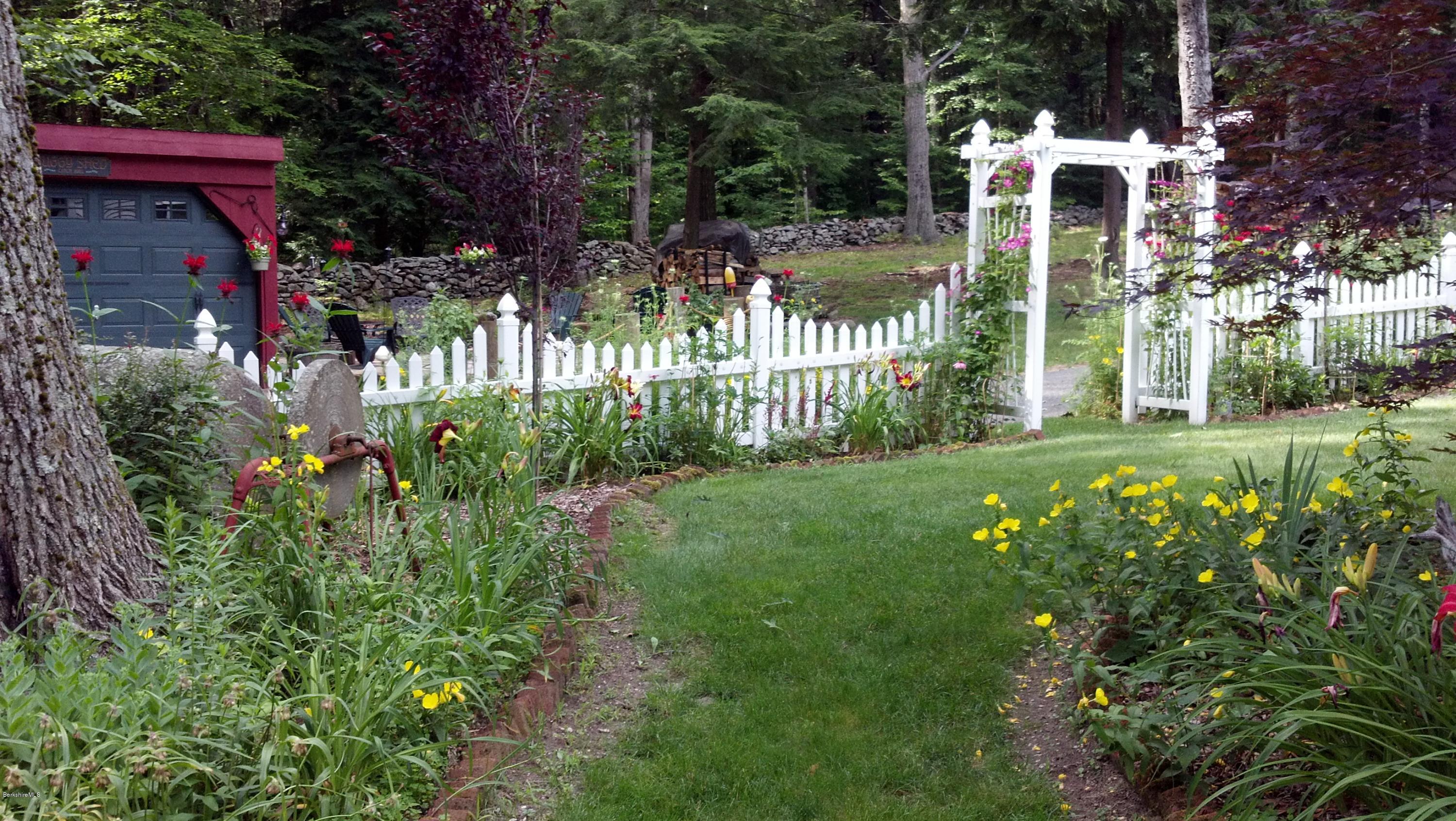 99 Kibbe Road Otis, MA 01029 - Photo 8 of 58 a front view of a house with garden