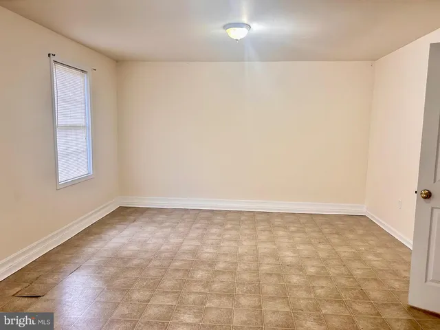 an empty room with a natural light
