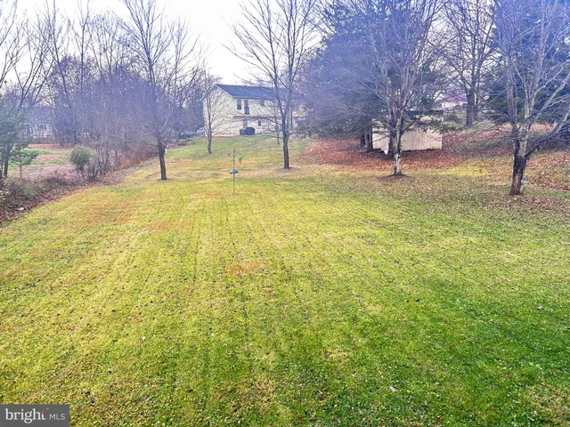 a house with swimming pool in front of it