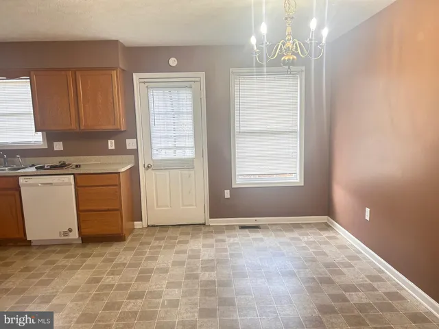 a view of a kitchen with a sink cabinets and a window