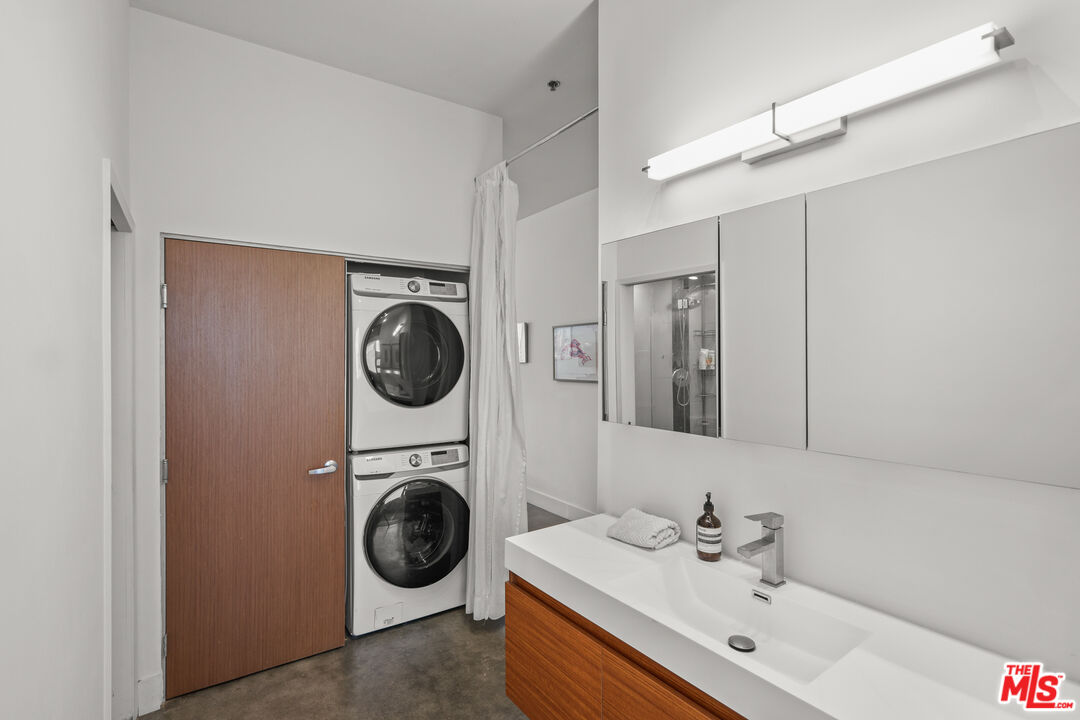 615 Hampton Drive, Unit A103 Venice, CA 90291 - Photo 11 of 20 a bathroom with a sink and a washing machine