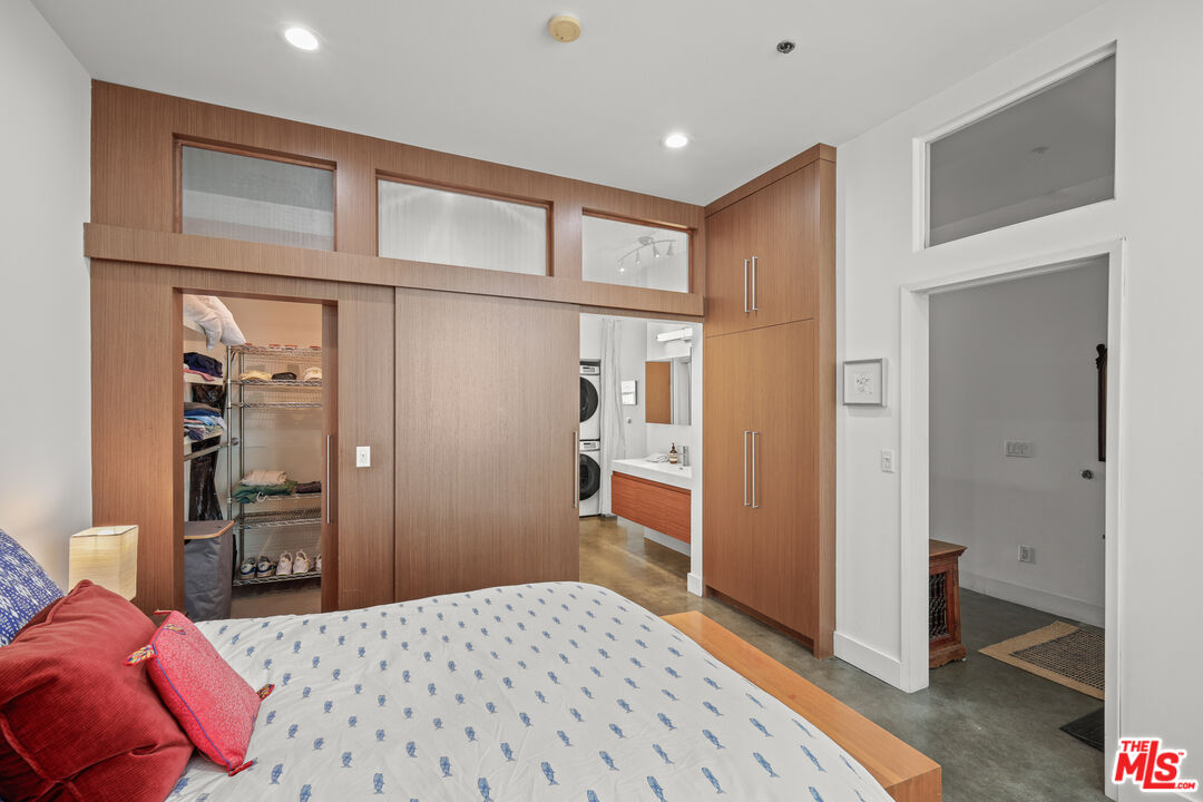 615 Hampton Drive, Unit A103 Venice, CA 90291 - Photo 8 of 20 a bedroom with a bed and a closet