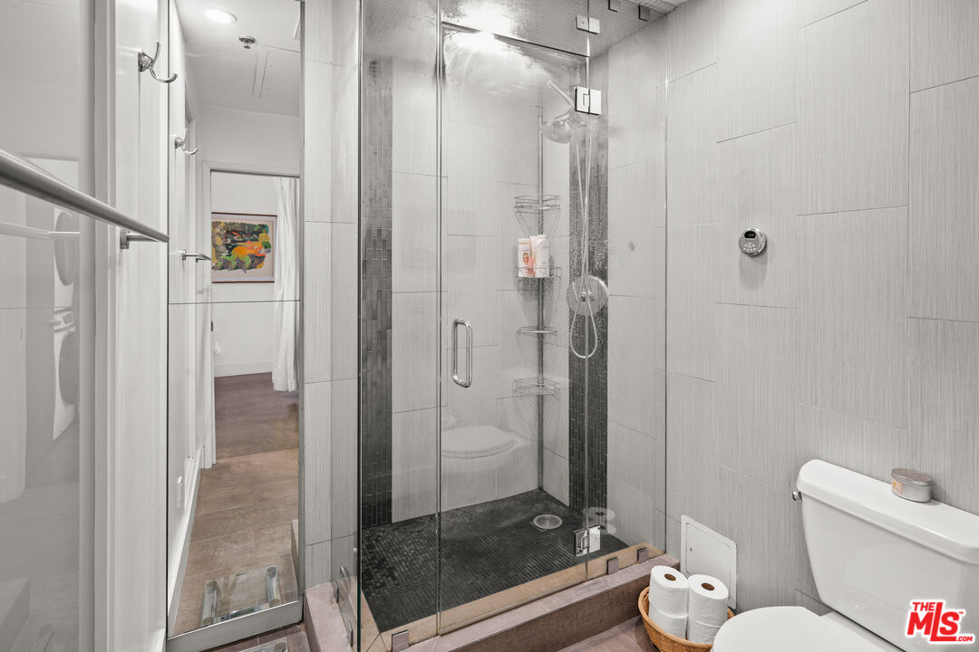 615 Hampton Drive, Unit A103 Venice, CA 90291 - Photo 10 of 20 a bathroom with a shower and toilet