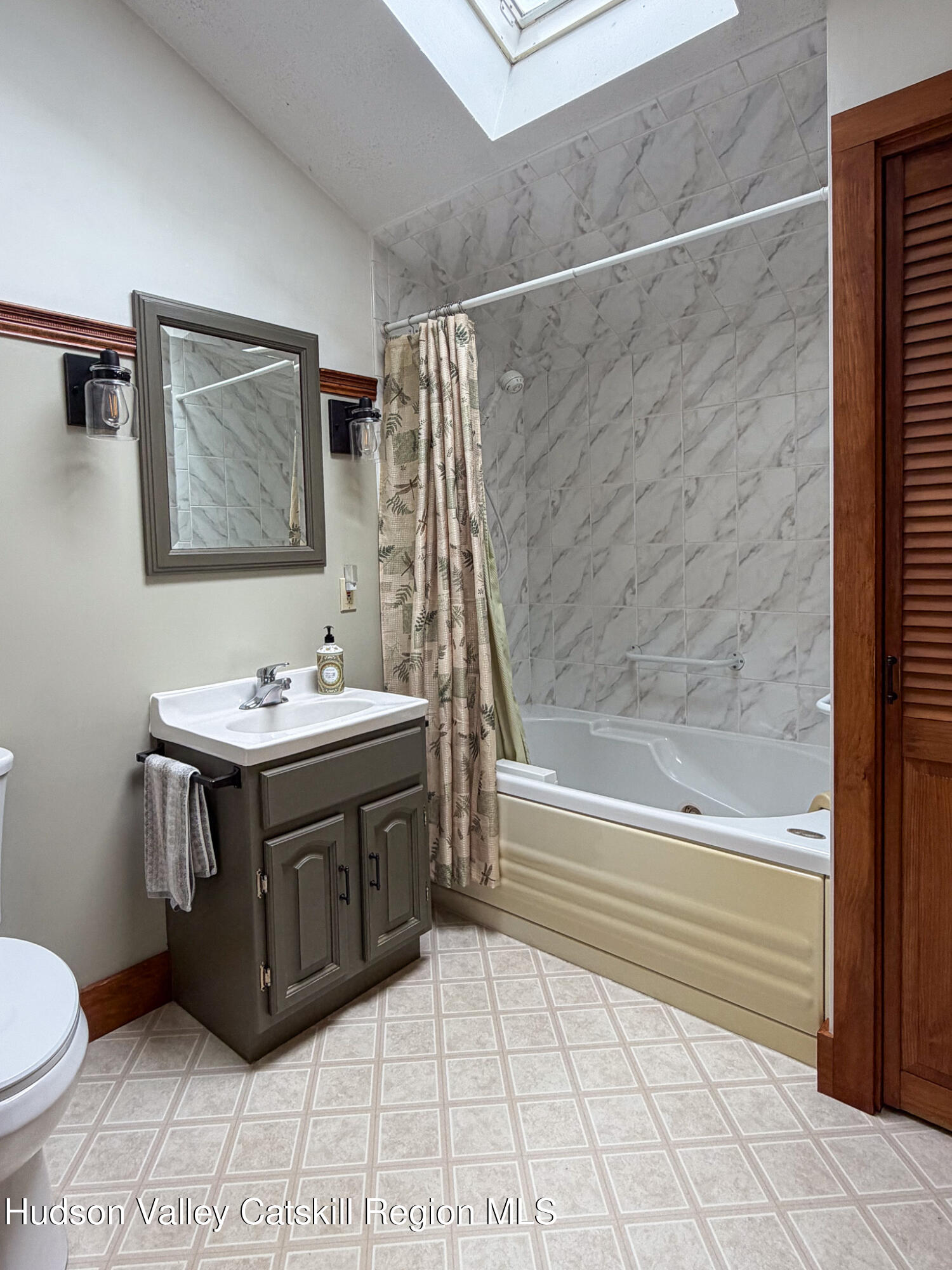 221 Camp Medusa Road Rensselaerville, NY 12120 - Photo 15 of 57 a bathroom with a sink a toilet and bathtub