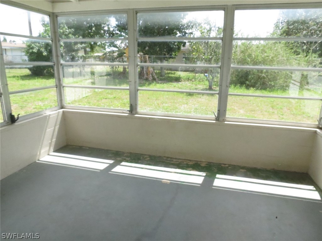 302 Penn Road West Lehigh Acres, FL 33936 - Photo 10 of 10 a view of an empty room with a window
